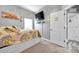 Comfortable bedroom with carpeted floors, a queen bed, and a mounted television at 9309 Edistro Pl, New Port Richey, FL 34654