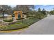 Elegant community entrance sign surrounded by manicured landscaping, creating a welcoming and upscale impression at 9309 Edistro Pl, New Port Richey, FL 34654