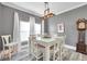 Dining room showcasing a modern table, elegant lighting, and decor at 9309 Edistro Pl, New Port Richey, FL 34654