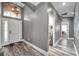 Bright entryway with modern flooring and white door, leading to laundry area at 9309 Edistro Pl, New Port Richey, FL 34654
