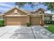 Charming single-Gathering home with a spacious three-car garage and manicured landscaping at 9309 Edistro Pl, New Port Richey, FL 34654
