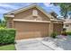 Inviting single-Gathering home with a spacious three-car garage and manicured landscaping at 9309 Edistro Pl, New Port Richey, FL 34654