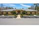 Beautiful community center with well-maintained landscaping and ample parking at 9309 Edistro Pl, New Port Richey, FL 34654