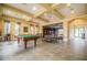 Community game room featuring a pool table, ping pong table, and ample space at 9309 Edistro Pl, New Port Richey, FL 34654