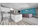 Bright, open floor plan features a spacious kitchen that flows seamlessly into the living area at 9309 Edistro Pl, New Port Richey, FL 34654