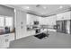 Kitchen featuring white cabinets, an island with a sink, and stainless steel appliances at 9309 Edistro Pl, New Port Richey, FL 34654