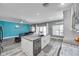 Open concept living area featuring a kitchen with island and a comfortable seating area at 9309 Edistro Pl, New Port Richey, FL 34654