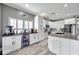 Modern kitchen with stainless steel appliances, island with beverage cooler at 9309 Edistro Pl, New Port Richey, FL 34654