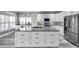 Spacious kitchen features a large island with modern stainless steel appliances at 9309 Edistro Pl, New Port Richey, FL 34654