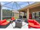 Outdoor patio offering comfortable seating, a grill, and picturesque water views at 9309 Edistro Pl, New Port Richey, FL 34654