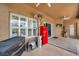Spacious covered patio with outdoor grill, red refrigerator and open design at 9309 Edistro Pl, New Port Richey, FL 34654