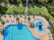 Community pool featuring lounge chairs, umbrellas, and a water area at 9309 Edistro Pl, New Port Richey, FL 34654