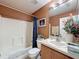 Well-lit bathroom with a shower and bathtub combination, providing a clean and functional space at 9431 Spring Hill Dr, Spring Hill, FL 34608