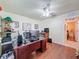 Spacious office with hardwood floors and a large desk, great for productivity and working from home at 9431 Spring Hill Dr, Spring Hill, FL 34608