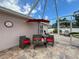 Cozy screened-in patio with comfortable seating, creating a perfect spot for relaxation and outdoor enjoyment at 9431 Spring Hill Dr, Spring Hill, FL 34608