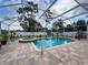 Beautiful screened-in pool and spa, perfect for outdoor relaxation and entertainment at 9431 Spring Hill Dr, Spring Hill, FL 34608