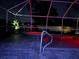 Night view of the pool with hot tub inside the screened enclosure at 9431 Spring Hill Dr, Spring Hill, FL 34608