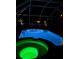 Pool and hot tub are lit at night inside the screened enclosure at 9431 Spring Hill Dr, Spring Hill, FL 34608