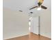 Bedroom with laminate floors, a ceiling fan, and a large closet at 9433 Stonewall Ln, New Port Richey, FL 34655
