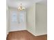 Entrance with wooden floors and white patterned glass doors at 9433 Stonewall Ln, New Port Richey, FL 34655