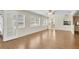 Bright living room with wood floors and natural light at 9433 Stonewall Ln, New Port Richey, FL 34655