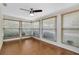 Sunroom with many windows and a ceiling fan at 9433 Stonewall Ln, New Port Richey, FL 34655