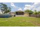 Spacious backyard with an above-ground pool and a screened-in patio, perfect for outdoor enjoyment at 9635 Century Dr, Spring Hill, FL 34608