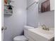 Bathroom featuring a white vanity, toilet, neutral paint, and modern fixtures at 9635 Century Dr, Spring Hill, FL 34608
