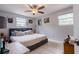 Comfortable bedroom featuring neutral paint, ceiling fan, and natural light from the windows at 9635 Century Dr, Spring Hill, FL 34608