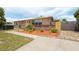 Charming single-story home featuring a well-manicured front yard and inviting curb appeal at 9635 Century Dr, Spring Hill, FL 34608
