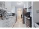 Updated kitchen with sleek stainless steel appliances and stylish backsplash and counters at 9635 Century Dr, Spring Hill, FL 34608