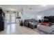 Bright and airy living room with tile floors and an open concept design at 9635 Century Dr, Spring Hill, FL 34608