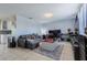 Comfortable living room with tile floors and views of the kitchen area at 9635 Century Dr, Spring Hill, FL 34608