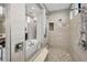 Luxurious bathroom showcasing glass shower and soaking tub at 9704 Milano Dr, Trinity, FL 34655