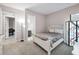 Bright bedroom with carpeting, a comfortable bed and access to the bathroom at 9704 Milano Dr, Trinity, FL 34655