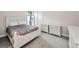 Cozy bedroom with plush carpeting and neutral color palette at 9704 Milano Dr, Trinity, FL 34655