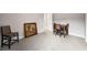 Spacious bonus room with chair, table, and carpeting at 9704 Milano Dr, Trinity, FL 34655