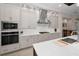 Well-appointed kitchen with stainless steel appliances, custom cabinets, and a bright, airy atmosphere at 9704 Milano Dr, Trinity, FL 34655
