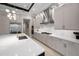 Expansive kitchen with light gray cabinetry, quartz countertops, and stainless steel appliances at 9704 Milano Dr, Trinity, FL 34655