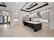 Open concept kitchen with a dark wood island, stainless steel appliances, and tile flooring at 9704 Milano Dr, Trinity, FL 34655