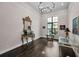 Formal living room featuring hardwood floors, tray ceiling, and elegant decor at 9704 Milano Dr, Trinity, FL 34655