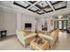 Inviting living room with coffered ceiling, tile floors, and comfortable seating arrangement for relaxation at 9704 Milano Dr, Trinity, FL 34655
