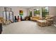 Comfortable living room with ample space, natural light, and views of lush greenery at 9704 Milano Dr, Trinity, FL 34655