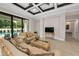 Comfortable living room with pool view, elegant furniture, and a sleek TV at 9704 Milano Dr, Trinity, FL 34655
