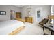 Cozy main bedroom with a large bed, dressers, and a comfortable chair at 9704 Milano Dr, Trinity, FL 34655