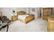 Spacious main bedroom showcasing elegant furnishings and a neutral color palette at 9704 Milano Dr, Trinity, FL 34655