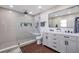 Updated bathroom boasts double vanity and a large walk-in shower with niche at 9706 Simeon Dr, Land O Lakes, FL 34638