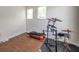 Bedroom with wood-look floors, two windows, and providing versatile living space at 9706 Simeon Dr, Land O Lakes, FL 34638