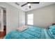 Bedroom with wood-look floors and a window provides natural light at 9706 Simeon Dr, Land O Lakes, FL 34638