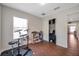 Bright bedroom with wood-look floors and a closet providing versatile living space at 9706 Simeon Dr, Land O Lakes, FL 34638